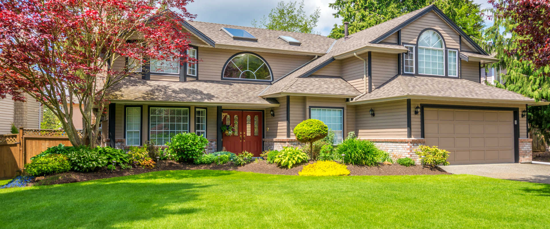 a house with a manicured lawn in front